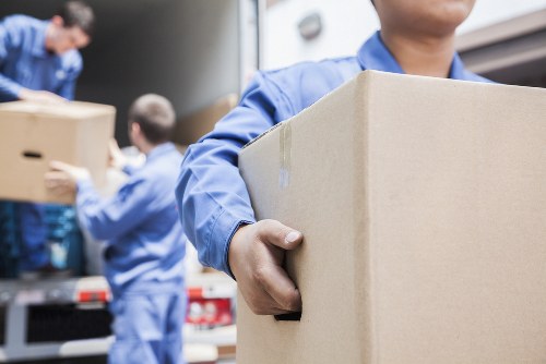 Removal van crew sorting recyclable moving materials in Mayfair