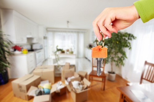 Staff handling furniture carefully during a removal job