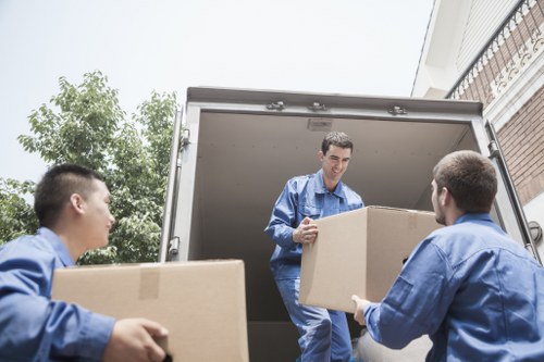 Removal specialists using safety measures during loading
