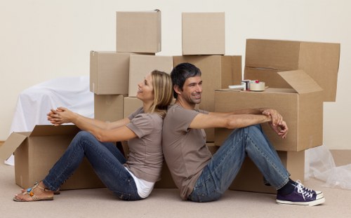 Local movers transporting furniture in a Mayfair residential building