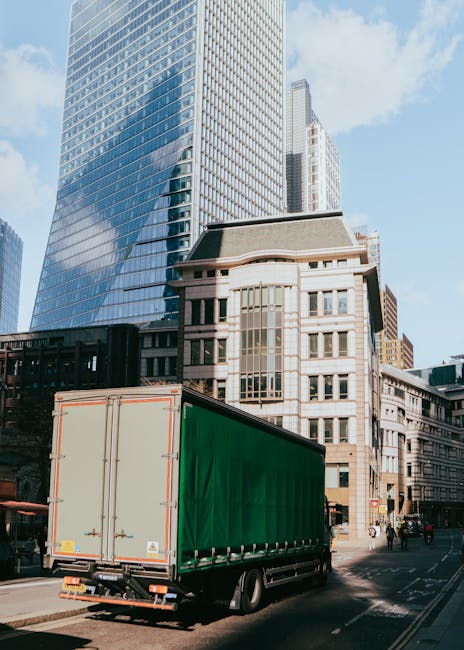 The image shows the exterior of a building with a stone facade housing 'Mayfair & Grace', a business that appears to be involved in relocations or removals, as indicated by the context of the webpage.